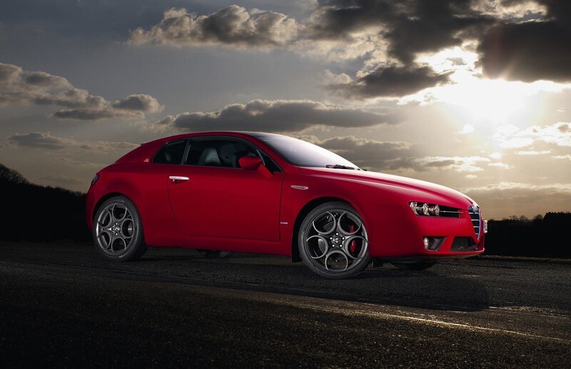 Red Alfa Romeo in sunset