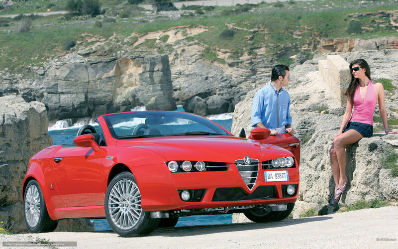 Red Alfa Romeo on coastal cliff