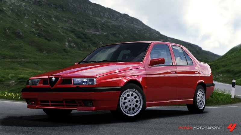Red Alfa Romeo on mountain road