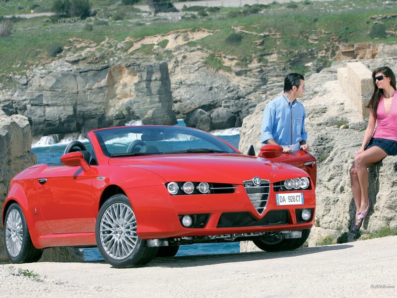 Red Alfa Romeo Spider by the coast