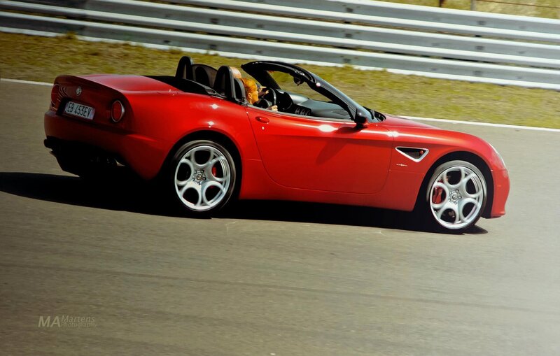 Red Alfa Romeo Spider on track
