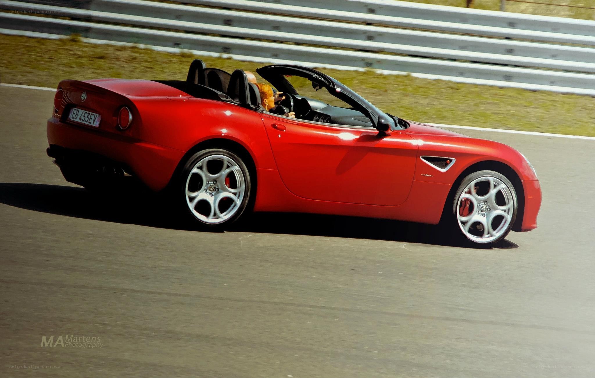 Red Alfa Romeo Spider on track
