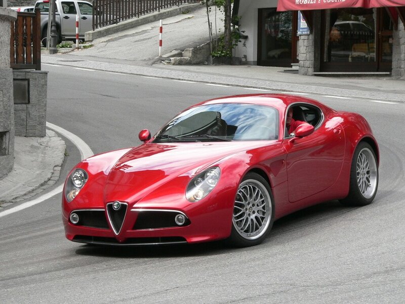 Red Alfa Romeo sports car on street