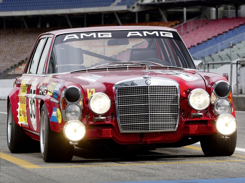 Red AMG race car on track