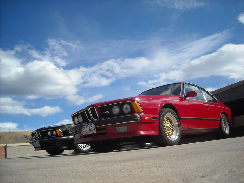 Red and black BMW cars