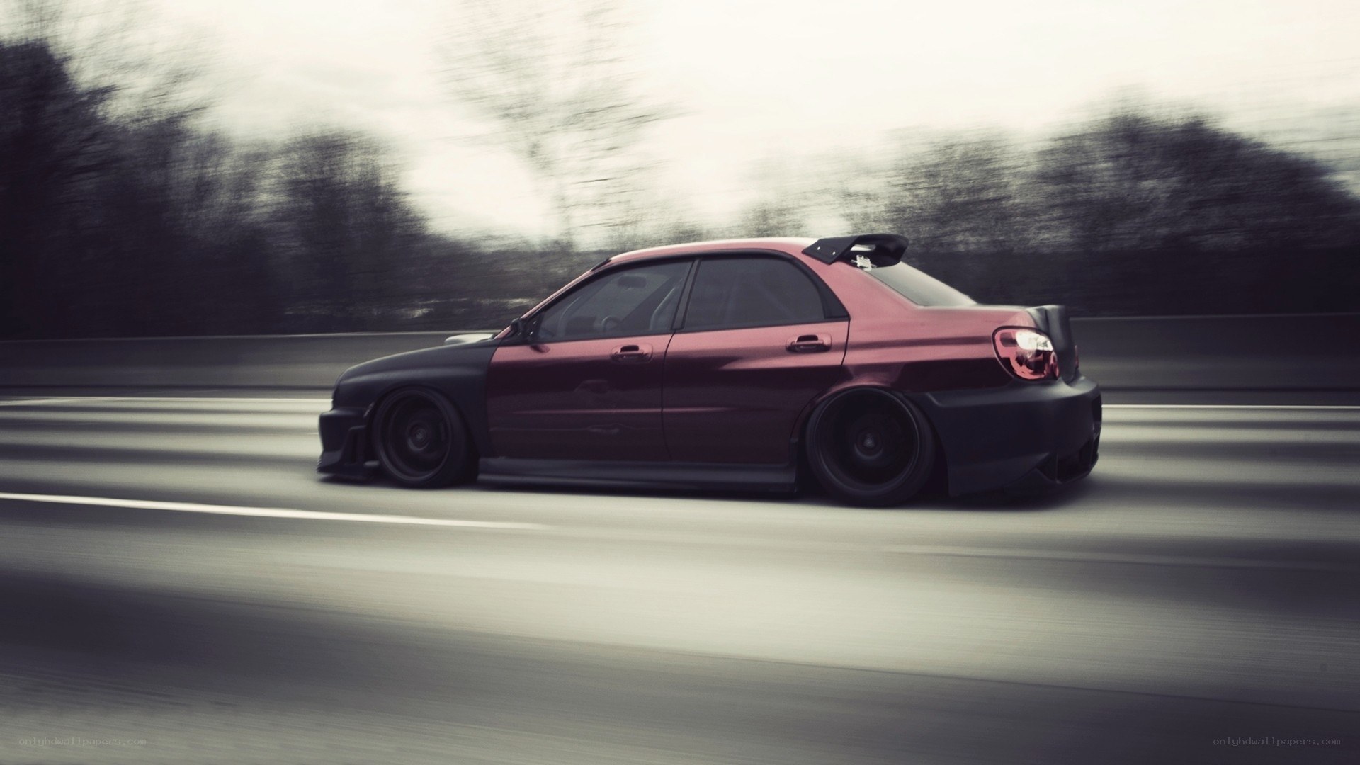 red and black car in motion