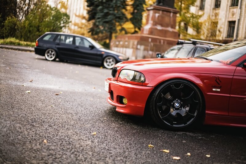 Red and black cars on street