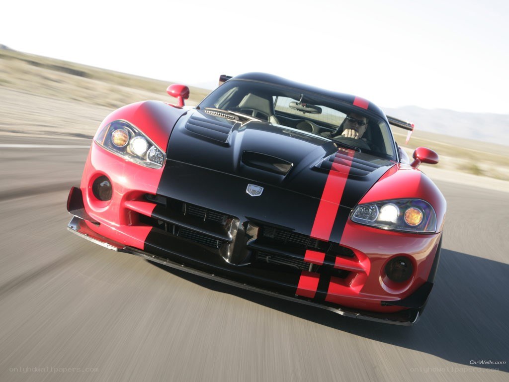 Red and black Dodge Viper in motion