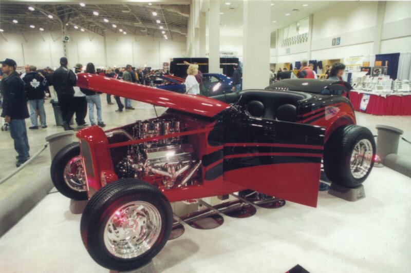 Red and black hot rod at car show