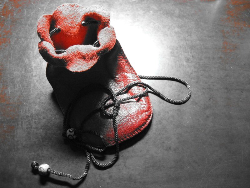 red and black leather pouch