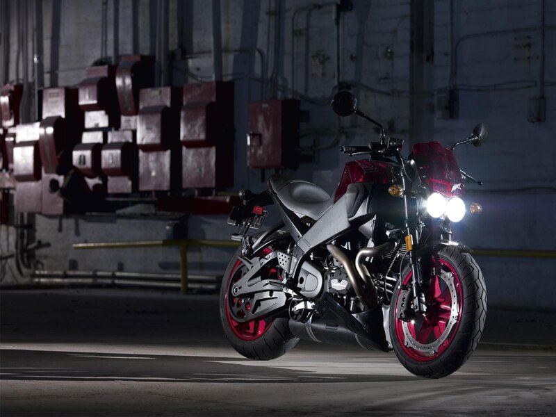 red and black motorcycle in garage