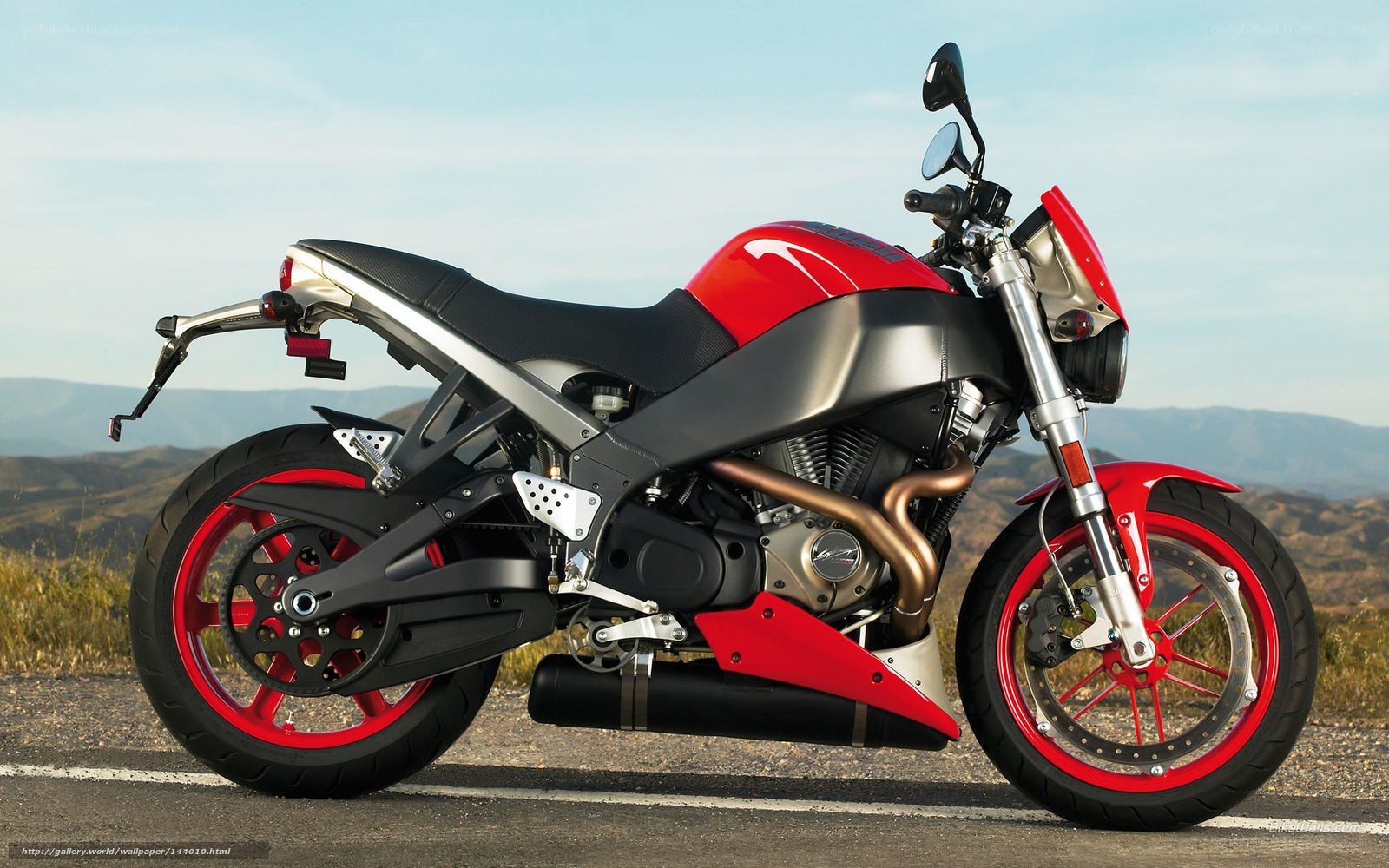 red and black motorcycle on road