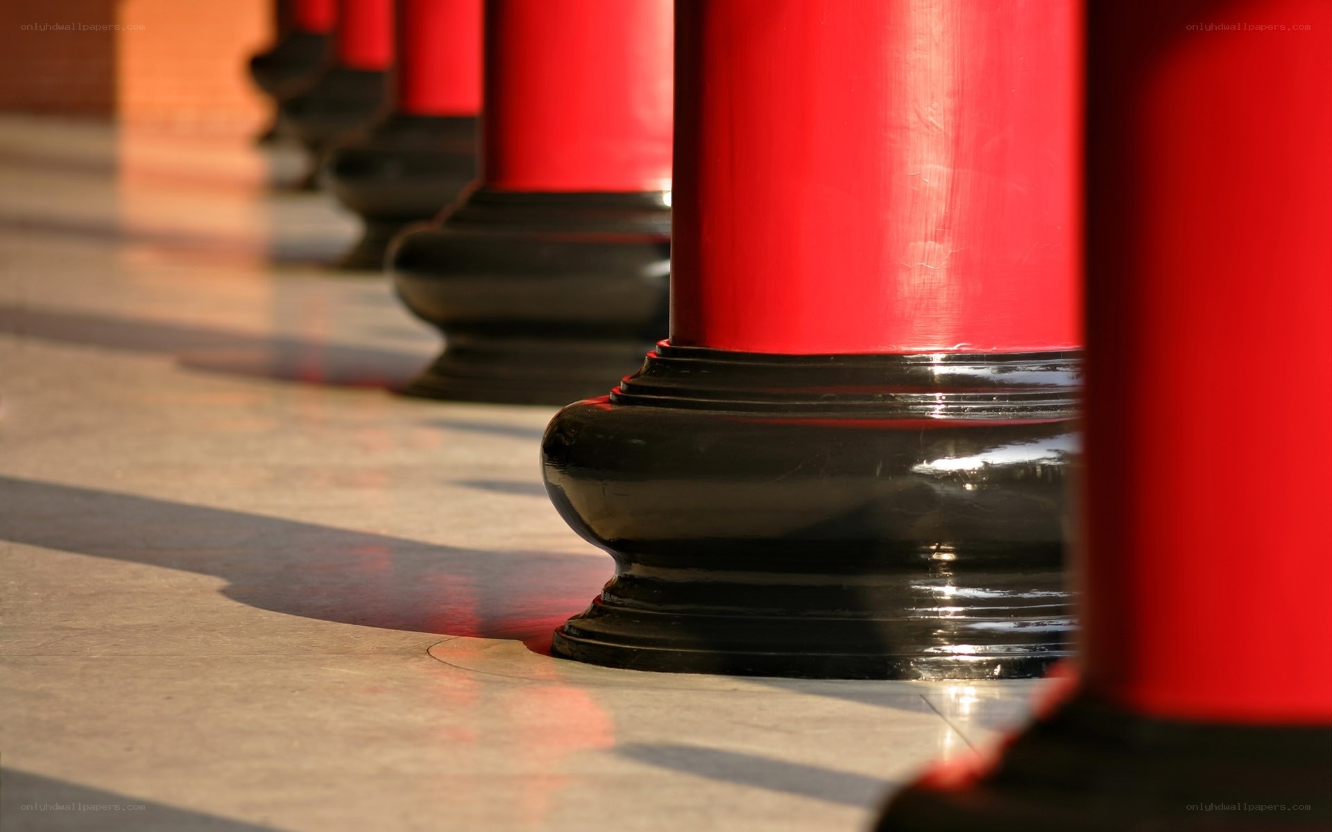 Red and black pillars in a row