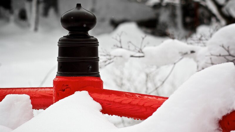 Red and Black Post in Snow