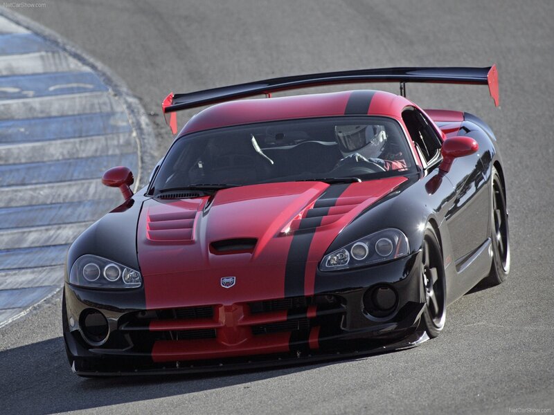 Red and black race car on track