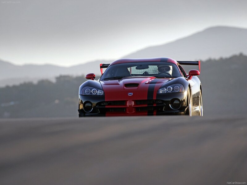 Red and black race car on track