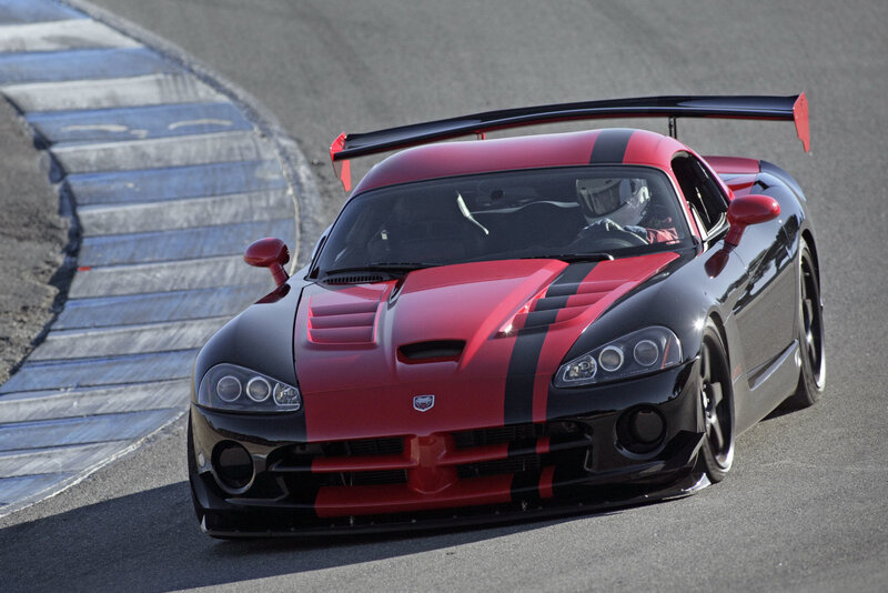 Red and black race car on track