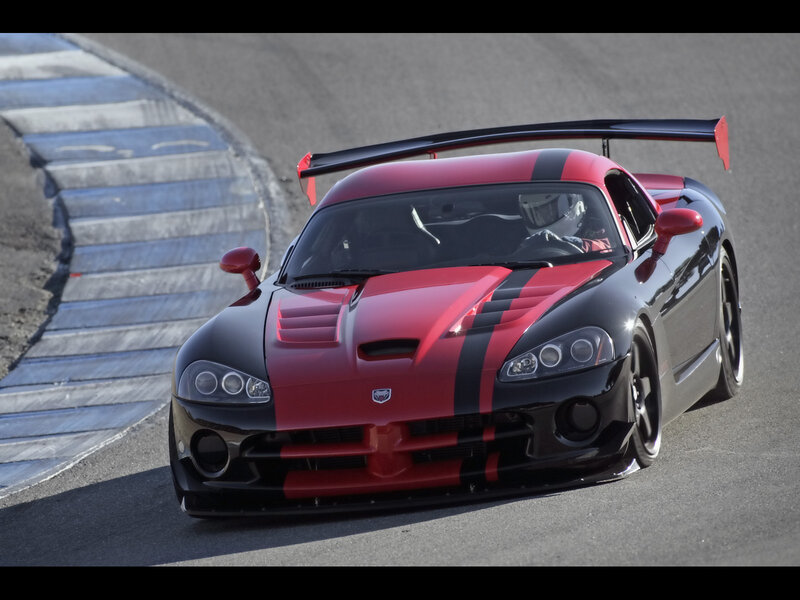 red and black race car on track