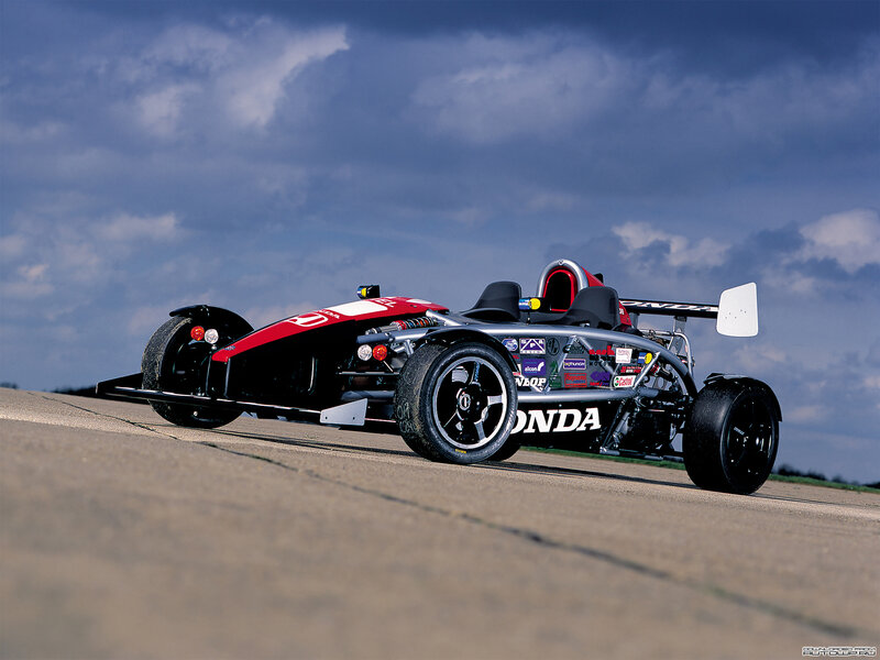 red and black race car on track