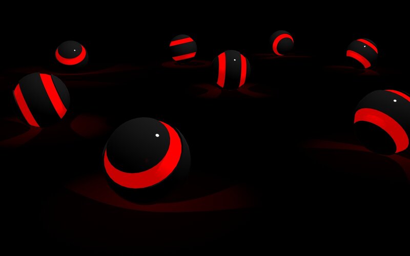 Red and black spheres on dark background
