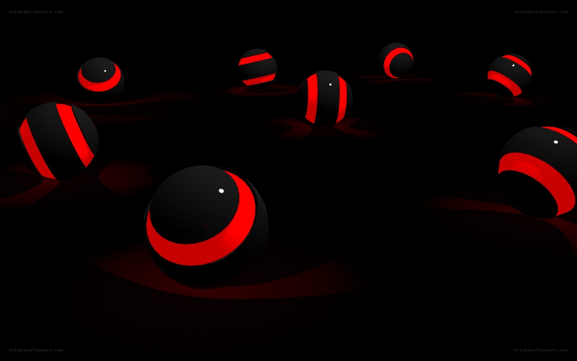 Red and black spheres on dark background