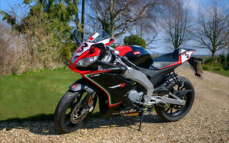 red and black sport motorcycle
