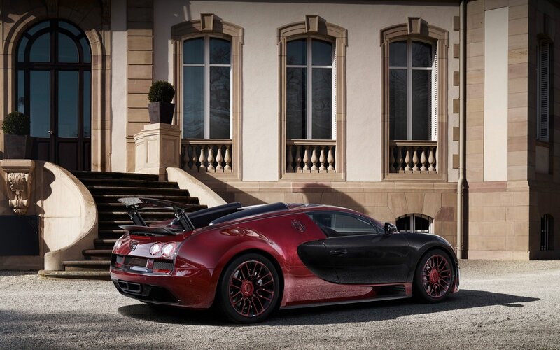 Red and Black Sports Car — Dramatic, Afternoon, Photograph, Building