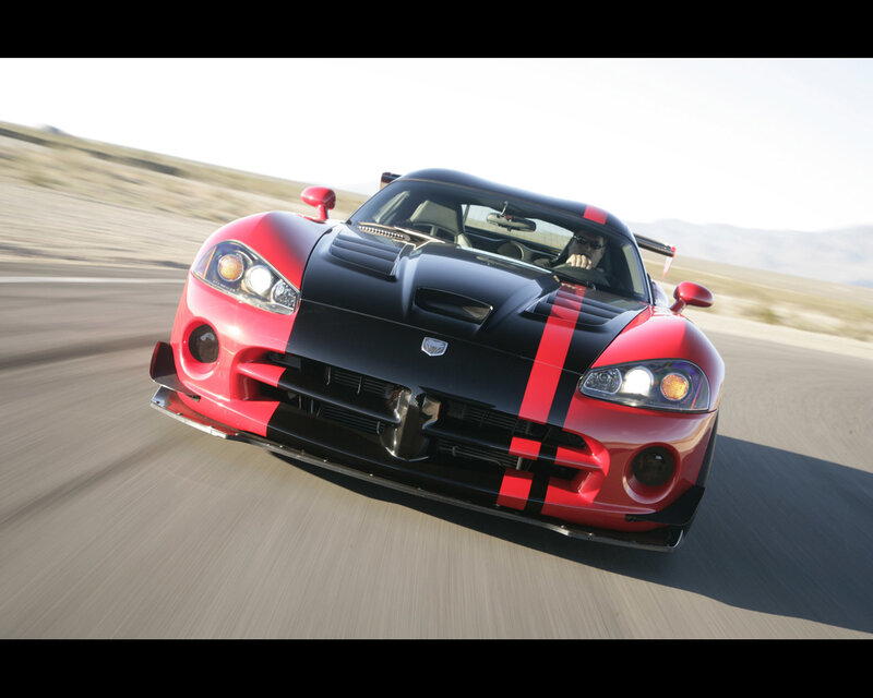red and black sports car in motion