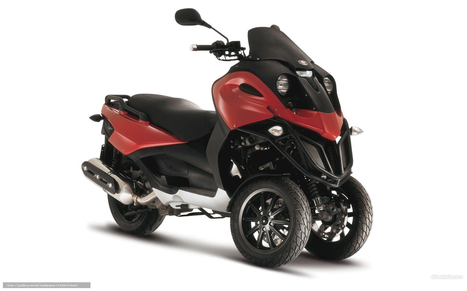 red and black three-wheeled scooter