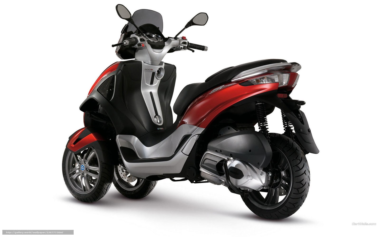 red and black three-wheeled scooter
