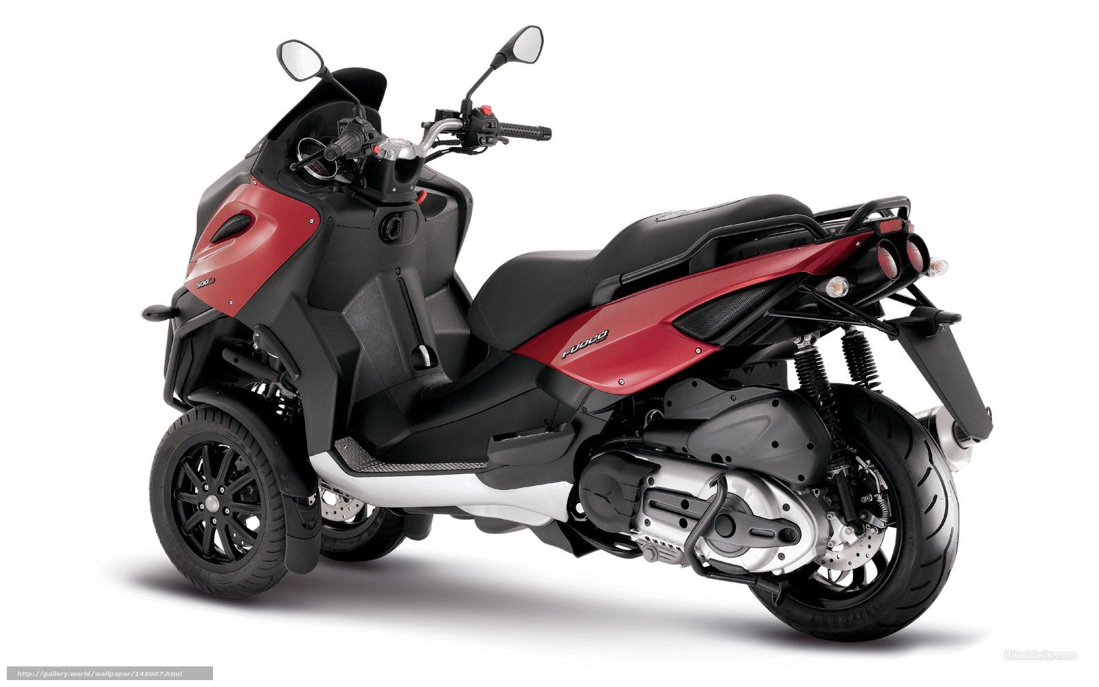 red and black three-wheeled scooter