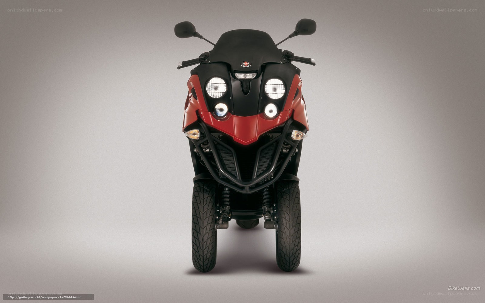 red and black three-wheeled scooter