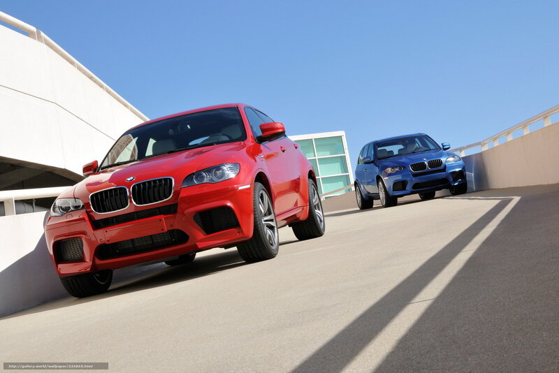 Red and blue BMW SUVs on ramp