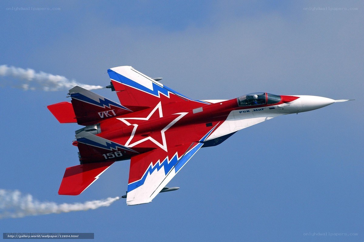 Red and blue fighter jet in flight