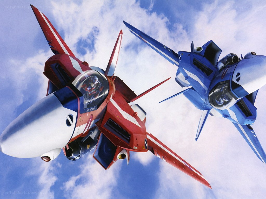 Red and blue fighter jets in flight