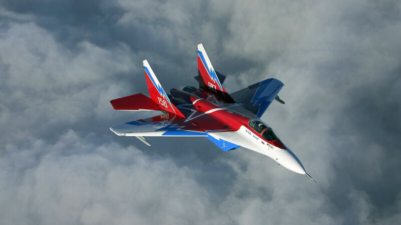 Red and Blue Jet Fighter — Dramatic, Photograph, Clouds