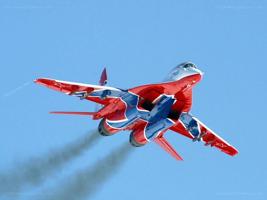 Red and blue jet in flight