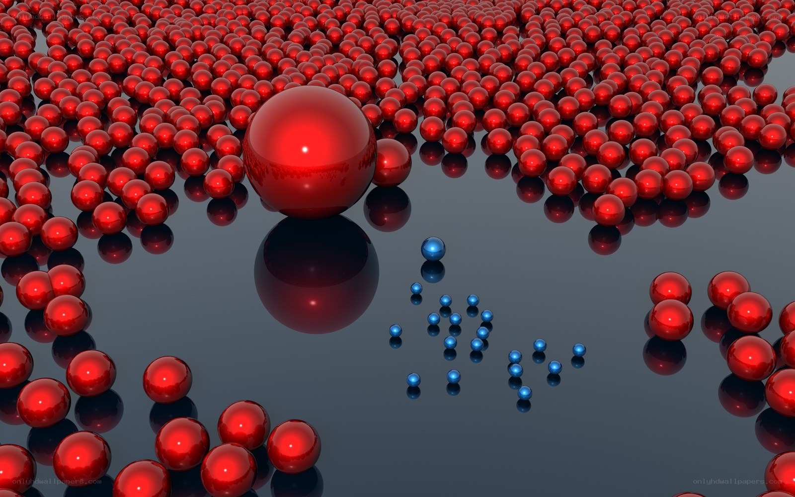 Red and blue spheres on reflective surface