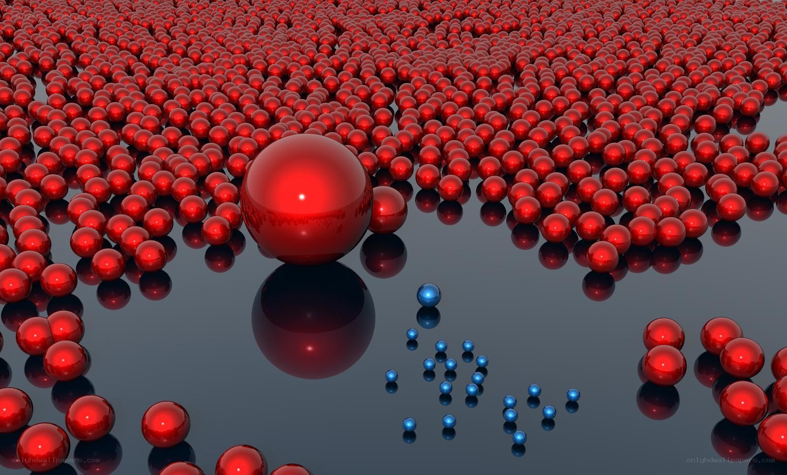 Red and blue spheres on reflective surface