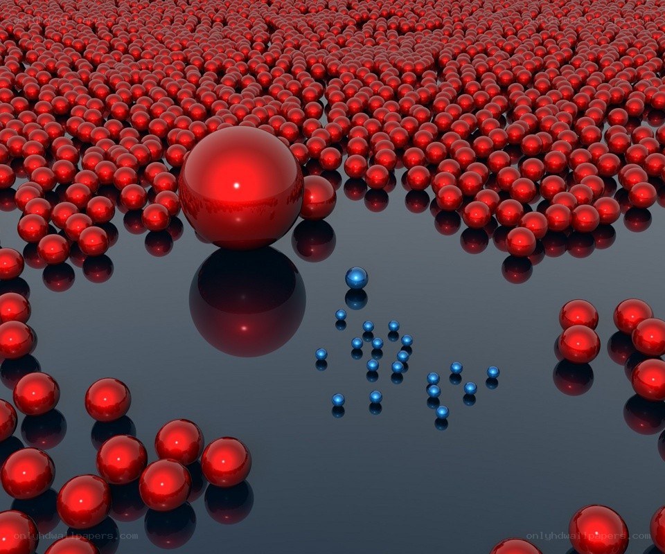 Red and blue spheres on reflective surface