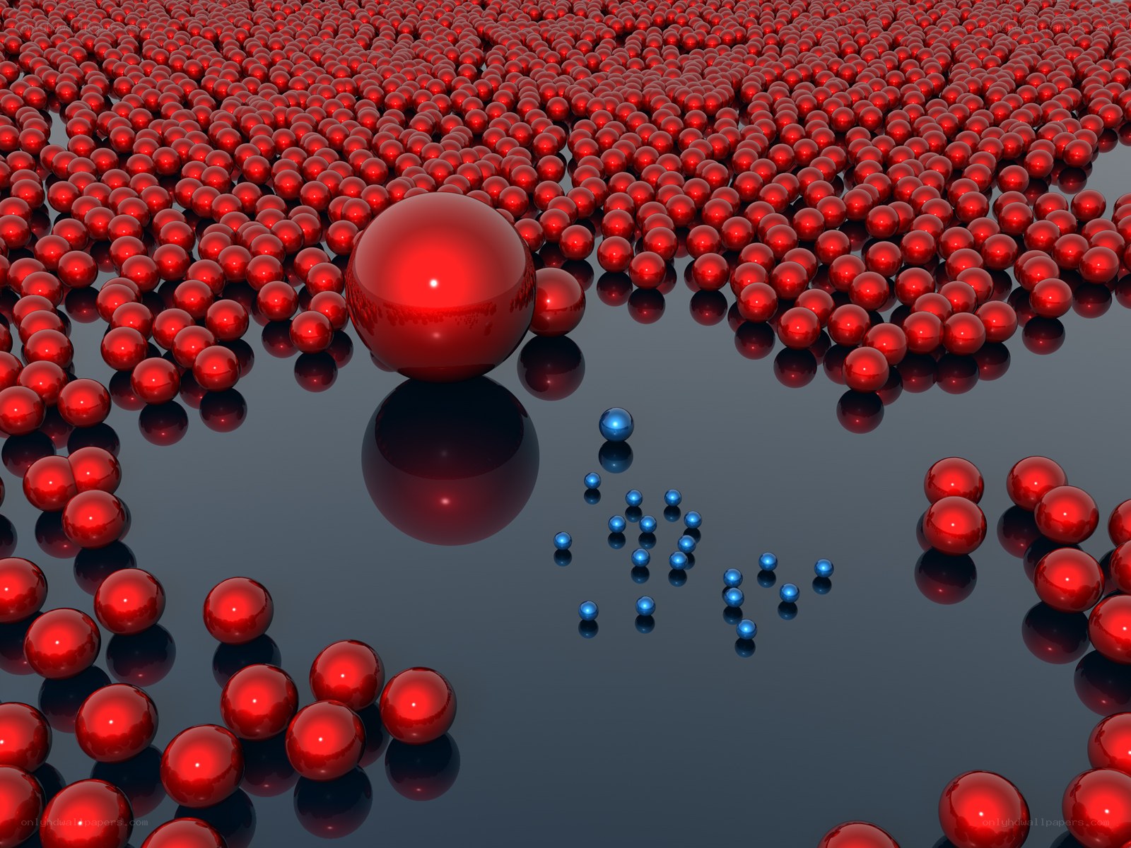 Red and blue spheres on reflective surface