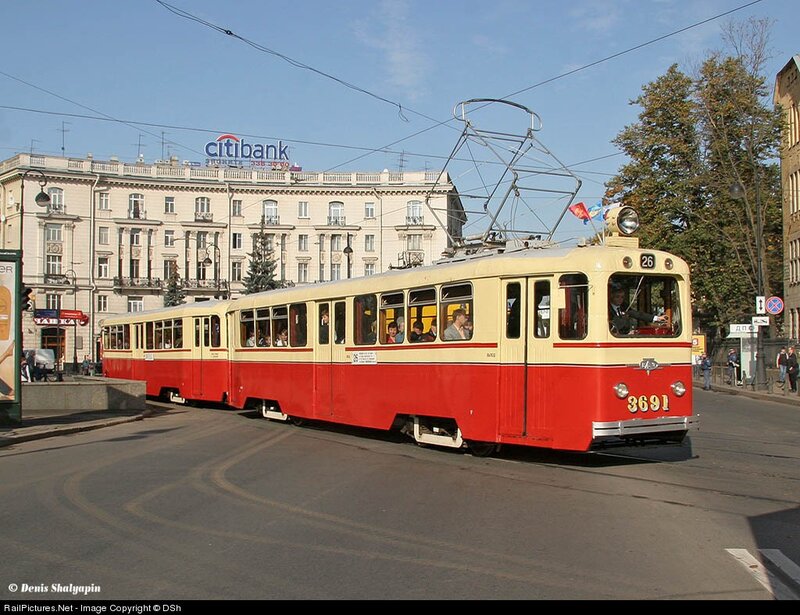 Red and cream tram in city
