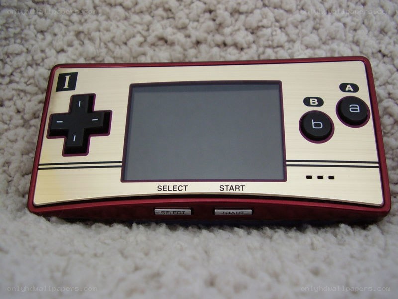 red and gold handheld game console