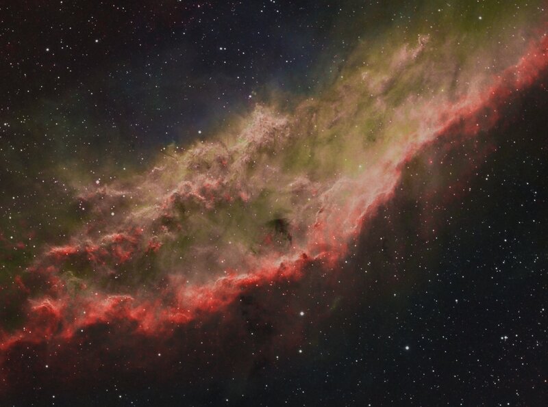 Red and green nebula in space