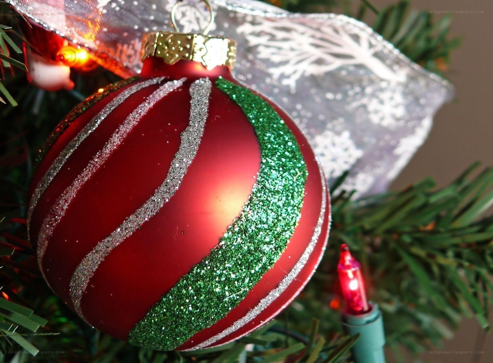 Red and green ornament on tree