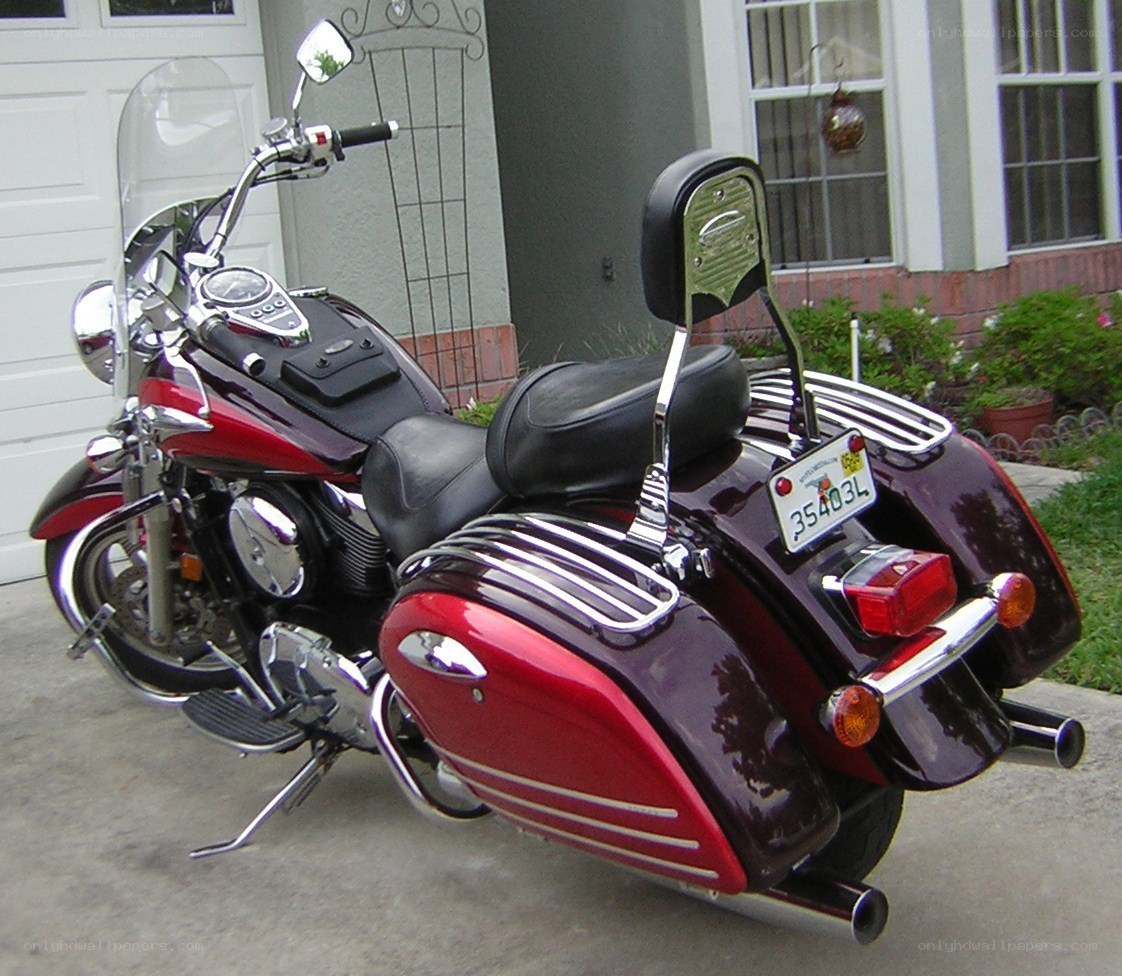 red and maroon touring motorcycle