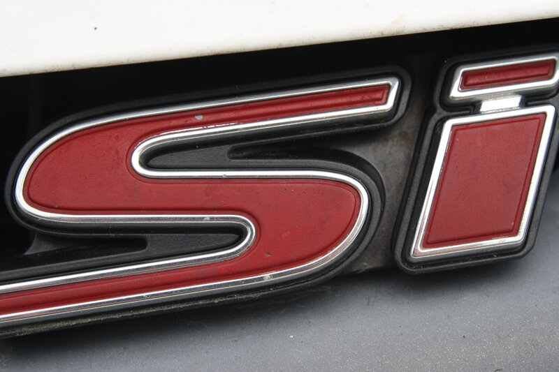 Red and Silver Car Emblem