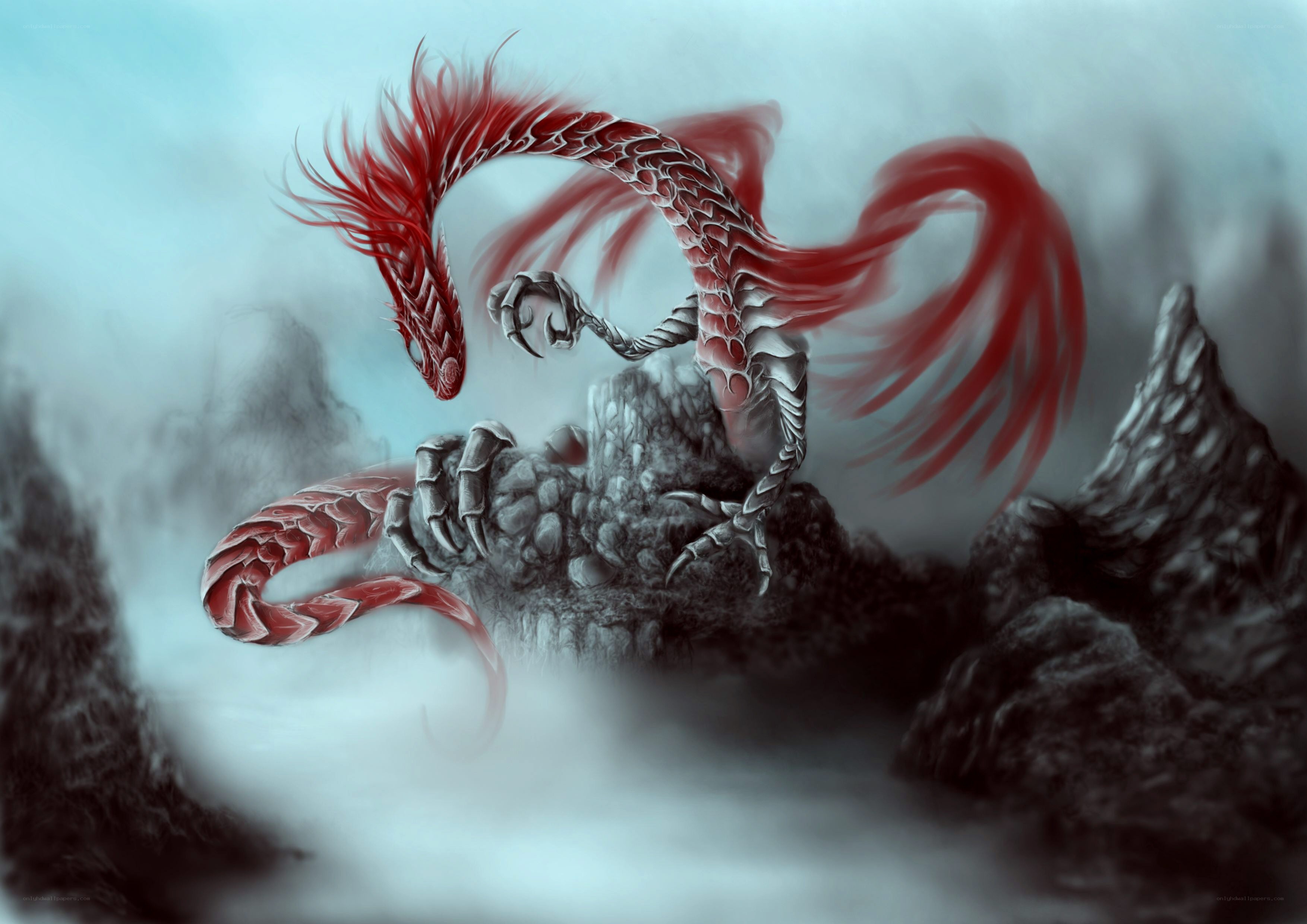 Red and silver dragon on a mountain