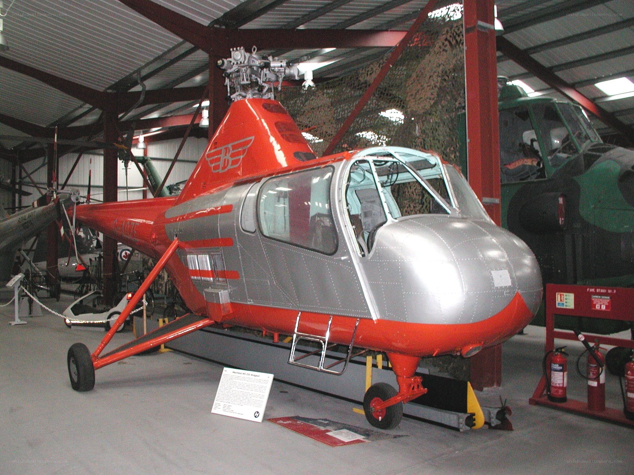 Red and silver helicopter on display