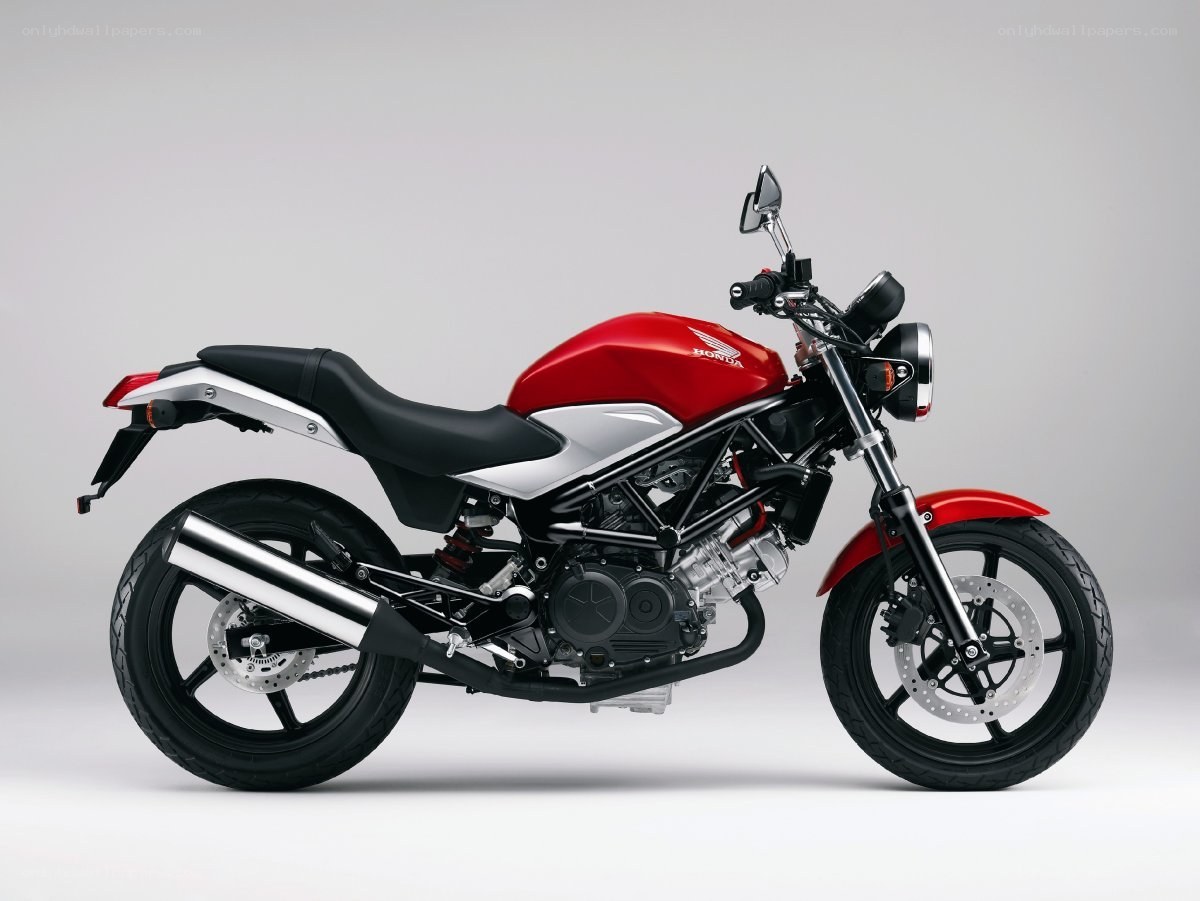 red and silver Honda motorcycle